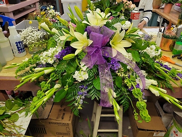 Casket Spray in Purple, Whites and Greens